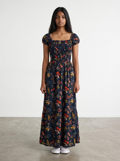 Rewearz black floral print 100% viscose wide-leg jumpsuit with smocked bustier and short sleeves.