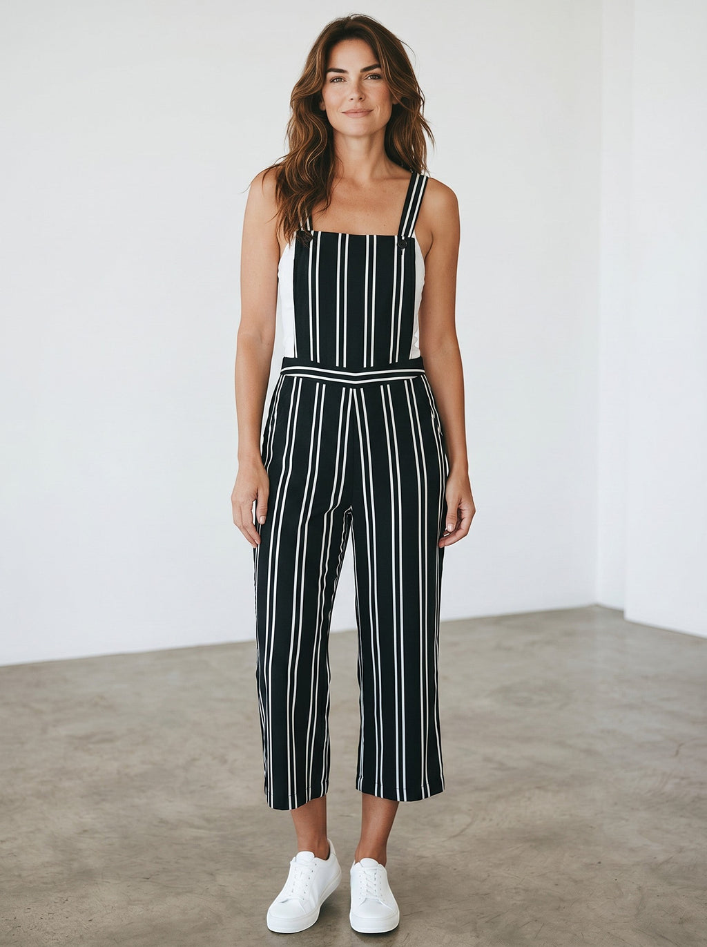 Rewearz black and white striped vintage chic jumpsuit with wide legs and adjustable straps.