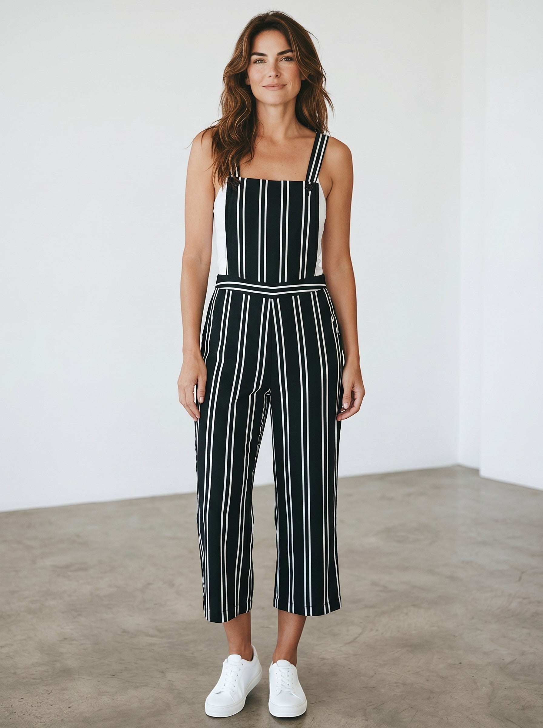 Rewearz black and white striped vintage chic jumpsuit with wide legs and adjustable straps.