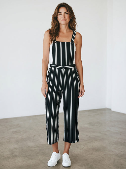 Rewearz black and white striped vintage chic jumpsuit with wide legs and adjustable straps.