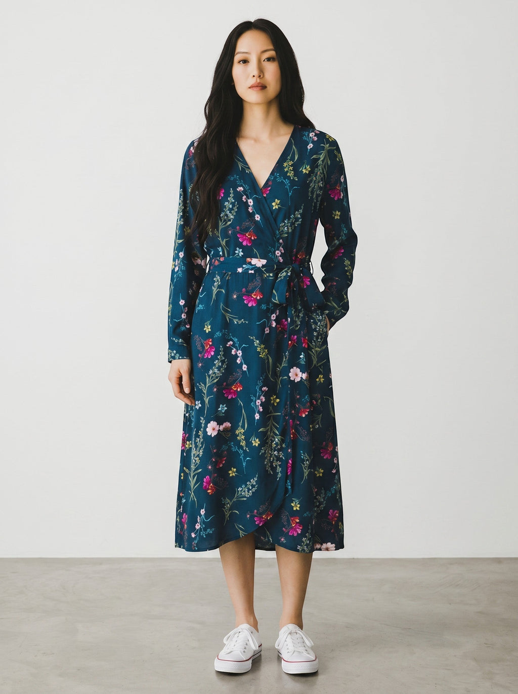 Rewearz blue floral print long sleeve wrap dress with V-neck and tie waist. Polyester fabric.
