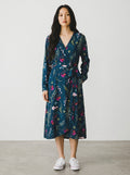 Rewearz blue floral print long sleeve wrap dress with V-neck and tie waist. Polyester fabric.