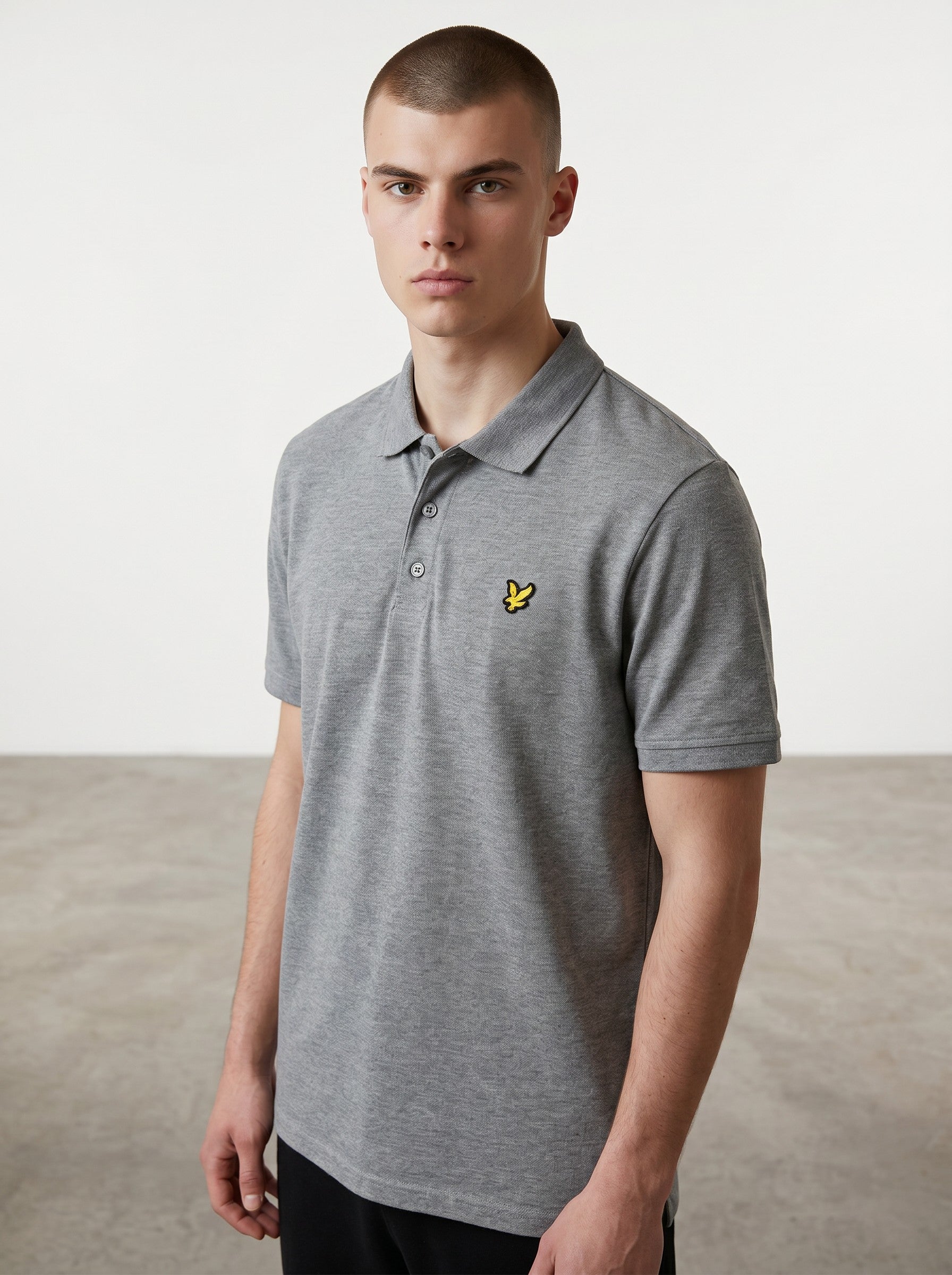 Rewearz grey short-sleeve polo shirt with embroidered yellow Lyle & Scott logo on chest, size XL.