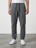 Rewearz grey Nike sweatpants with embroidered white swoosh logo, elastic waistband, and cuffed ankles.