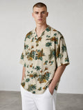 Rewearz beige 100% rayon vintage Hawaiian shirt with surf and tropical motifs. Relaxed fit.