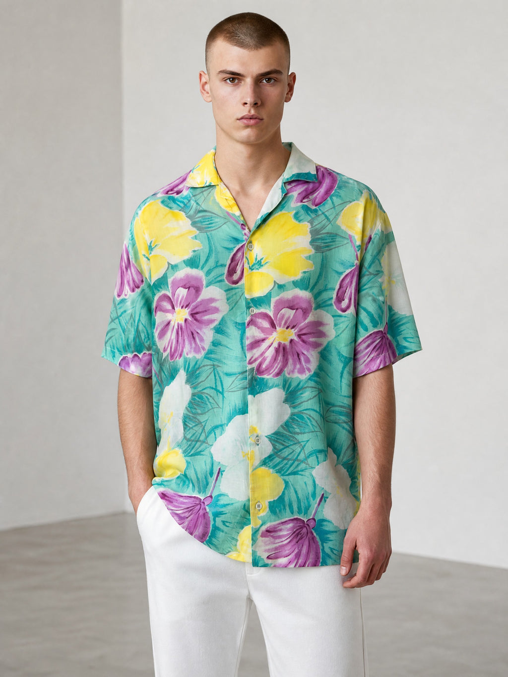 Rewearz Islander vintage rayon Hawaiian shirt with purple, yellow, and white floral print on a teal background.