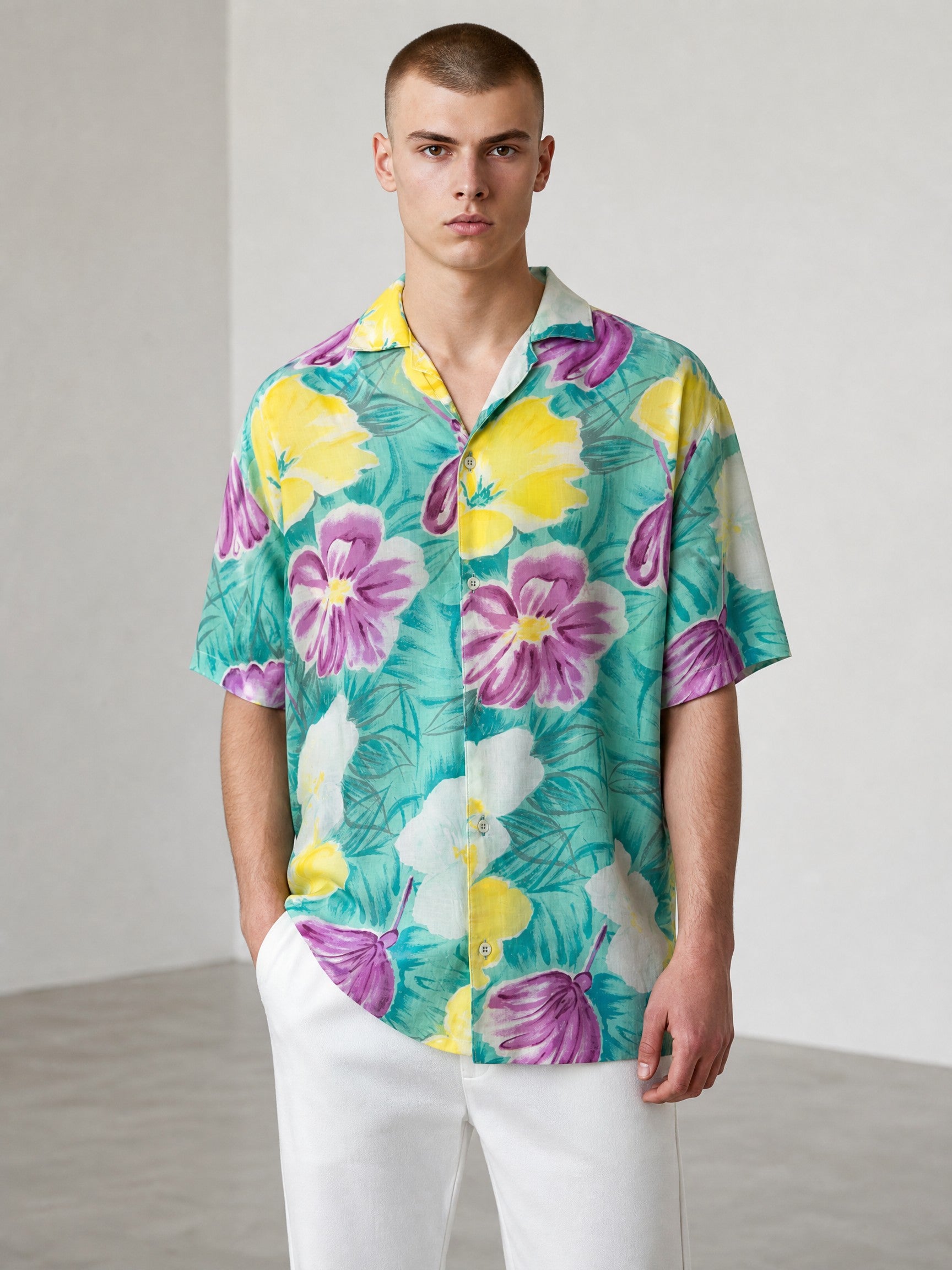 Rewearz Islander vintage rayon Hawaiian shirt with purple, yellow, and white floral print on a teal background.