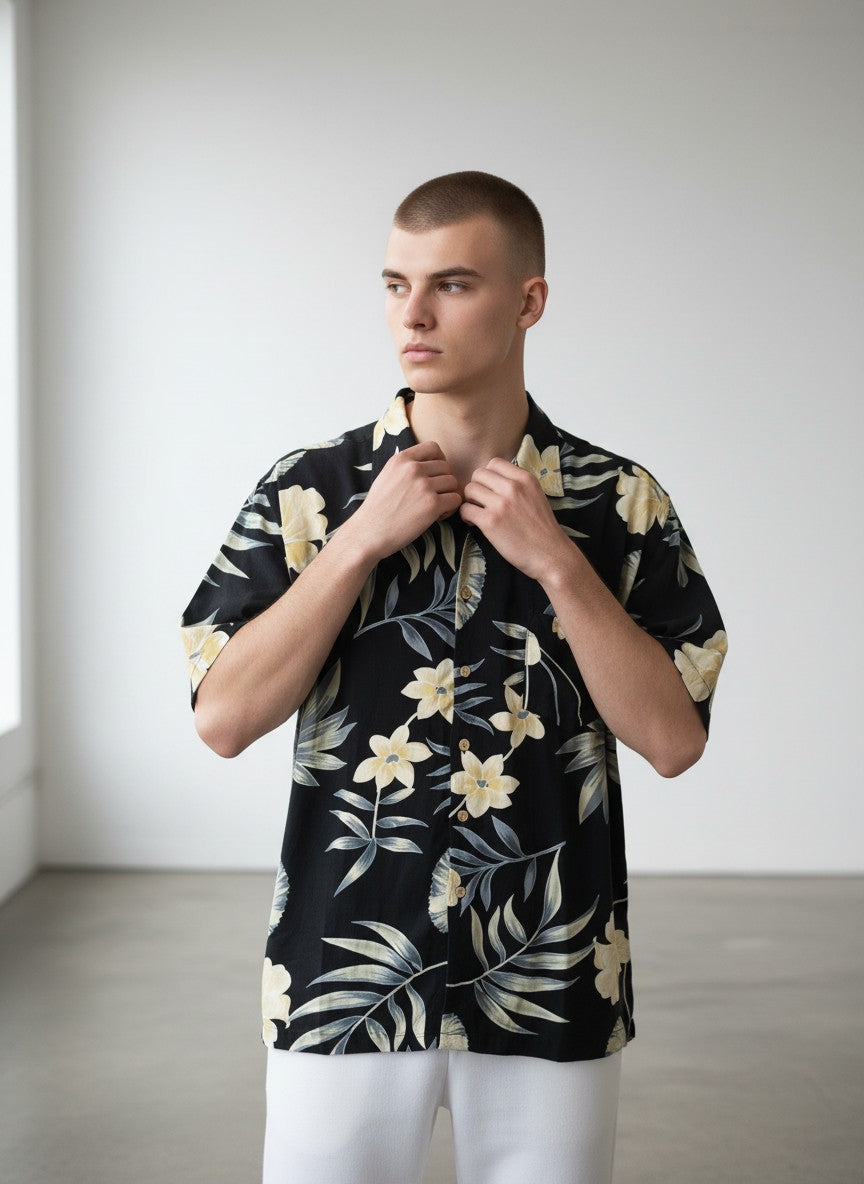 Rewearz black 100% silk Hawaiian shirt with yellow flowers and tropical leaves pattern, short sleeves, relaxed fit.