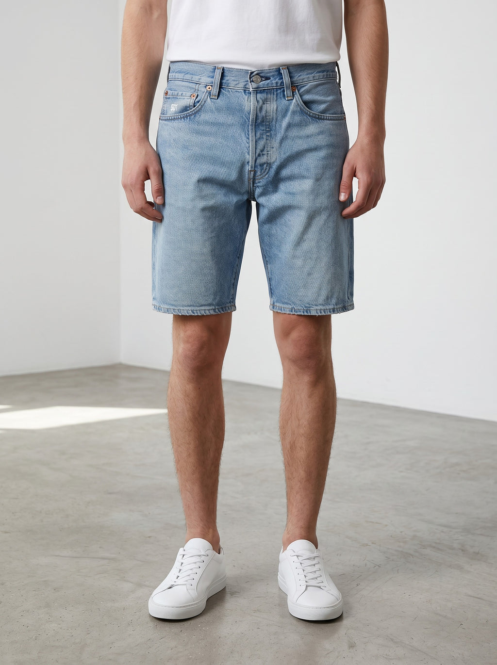 Rewearz light wash blue denim Levi's 501 jort shorts with a straight fit and button fly.