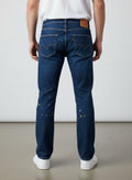 Rewearz Levi's 502 Taper jeans in dark blue denim with paint splatter details. Modern fit.