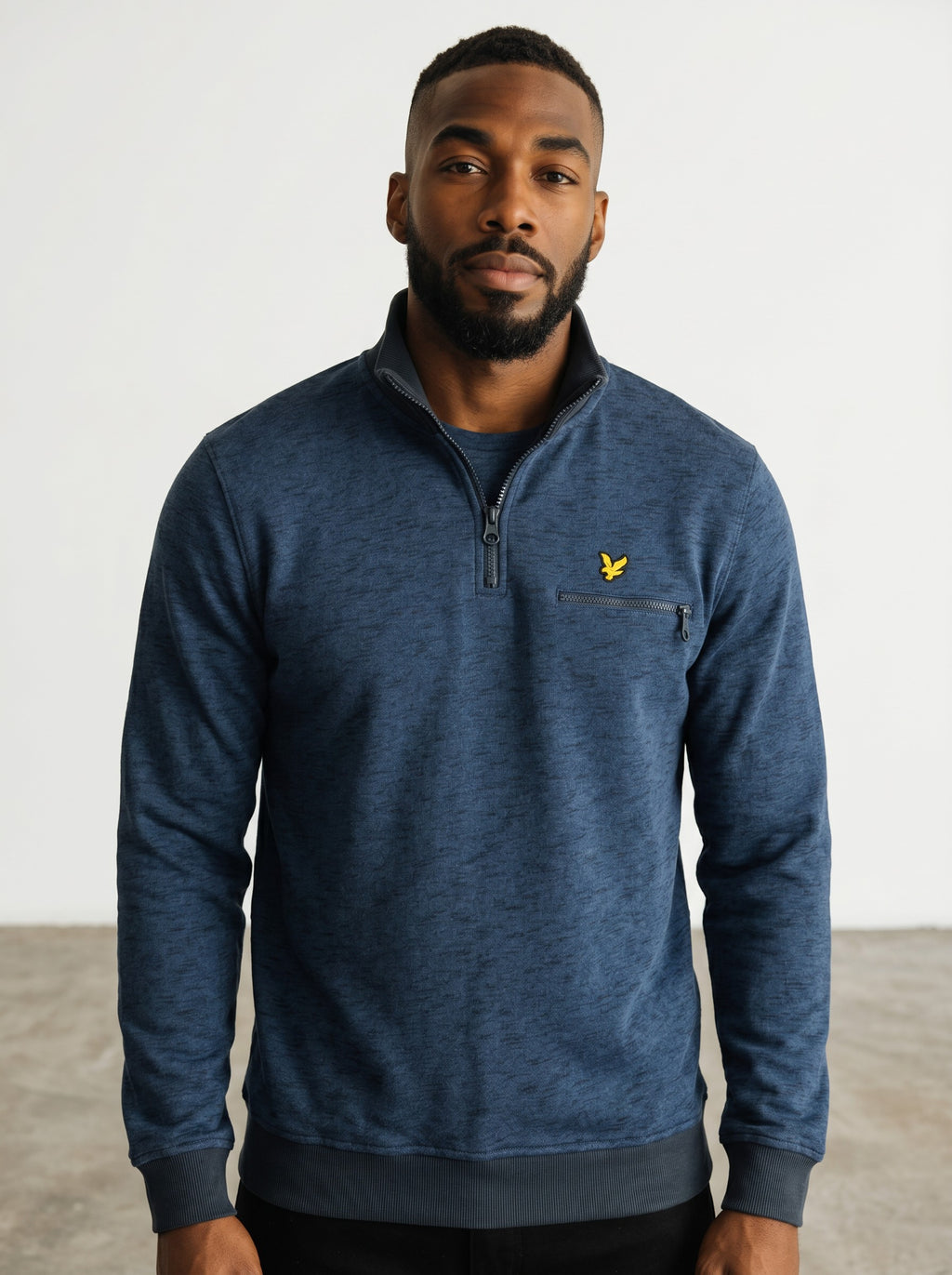 Rewearz navy blue marled knit quarter zip pullover sweater with embroidered yellow eagle logo and zip chest pocket.