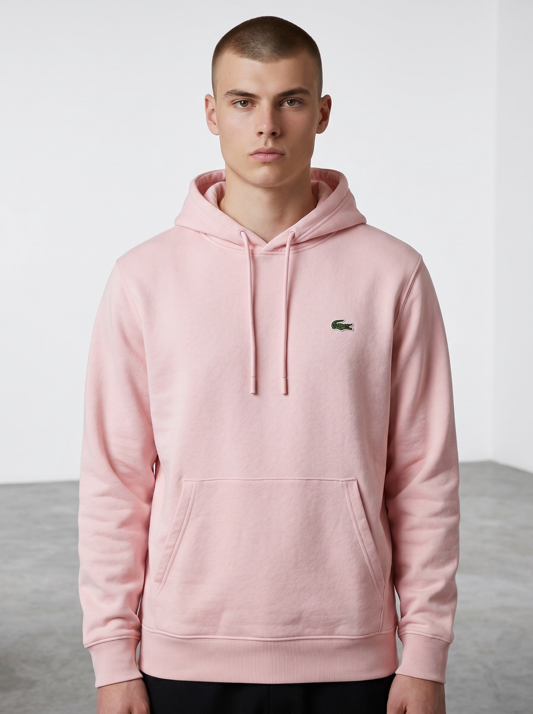 Rewearz pink cotton blend hoodie with embroidered green crocodile logo on chest, drawstring hood, and front pocket. Size 3 small.