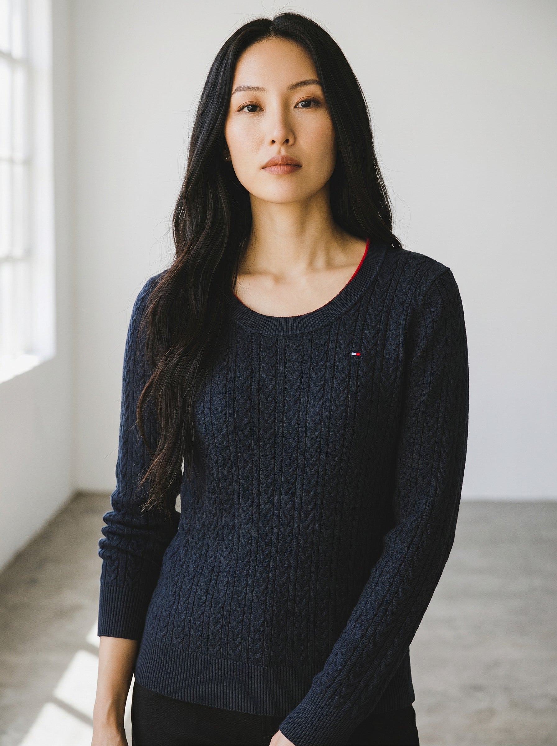 Tommy Hilfiger black cable knit crewneck sweater with embroidered logo on chest. Cotton blend.