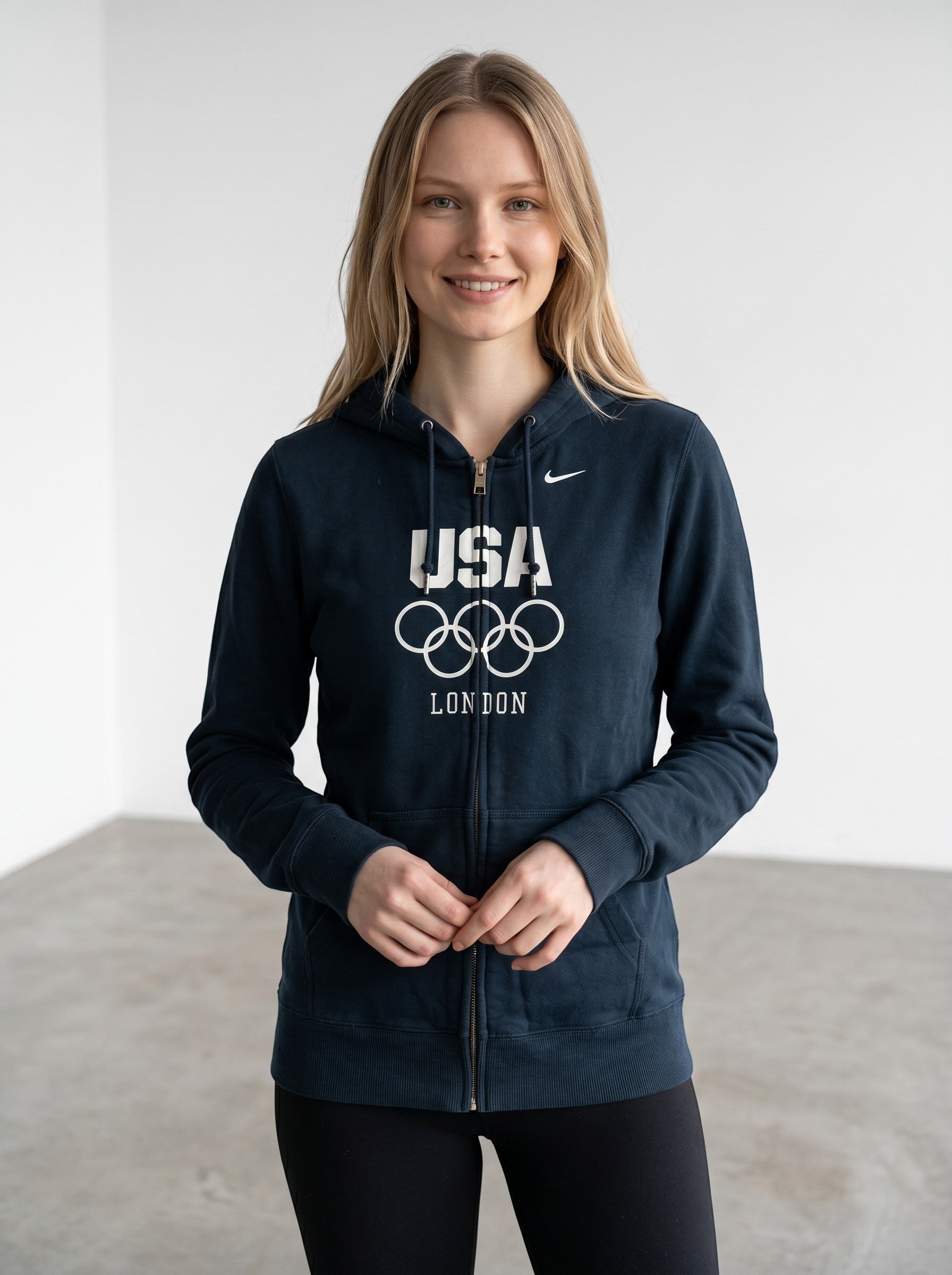 RewearzHere navy blue Nike USA London Olympics zip-up hoodie with Olympic rings graphic. Soft fleece material.